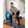Man performing squats with blue vinyl-dipped 20lb kettlebell