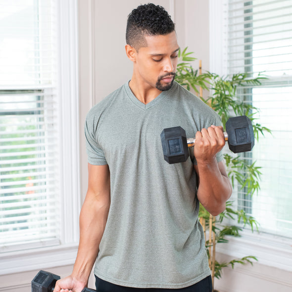 Man performing biceps curls with 15lb hex dumbbell