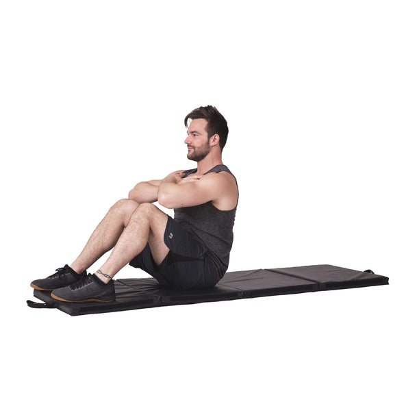 Man doing sit-ups on 4-way foldable fitness mat