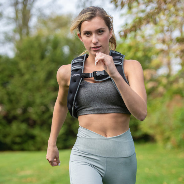 Woman running while wearing 10lb weighted vest