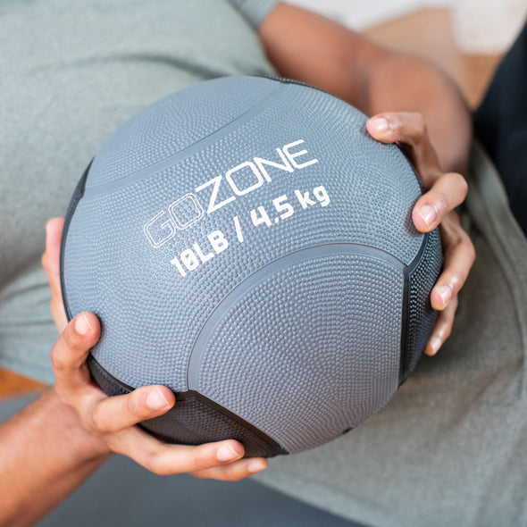 Athlete working out with medicine ball