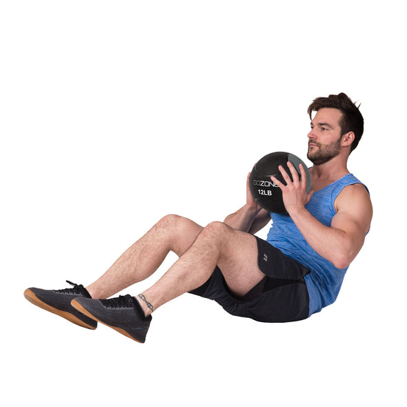 Man working out with 12lb medicine ball