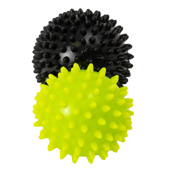 Massage balls pictured side by side to show that black is bigger than green