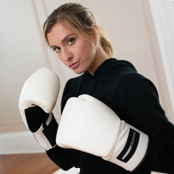 Woman with 14oz gloves from the POV of her sparring partner