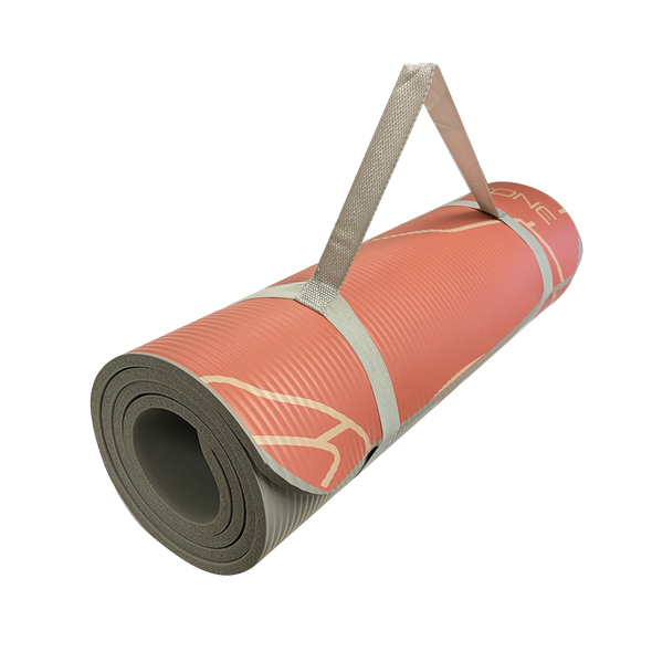 10mm mountain fitness mat rolled up with strap from off-center 45-degree angle