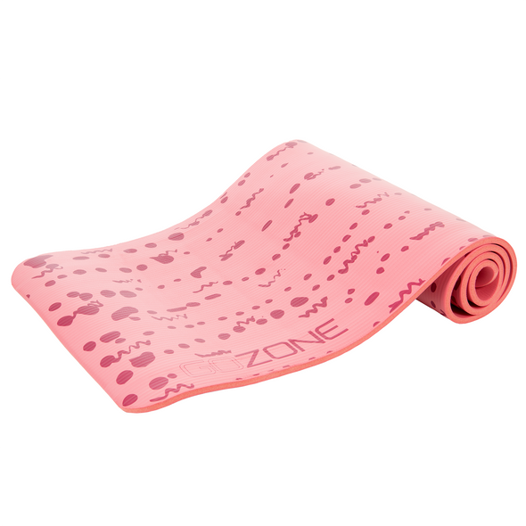 Pink/red exercise mat partially unrolled
